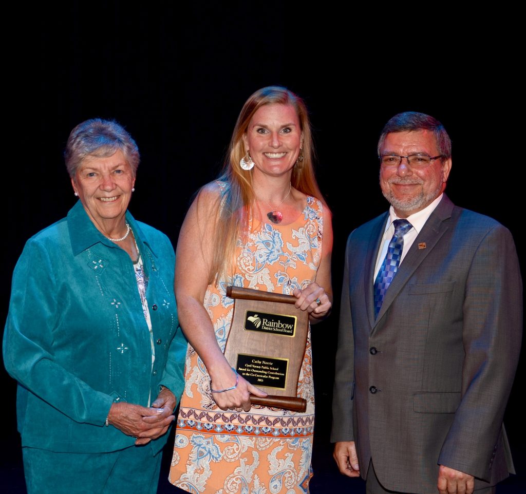 A staff member accepting an award