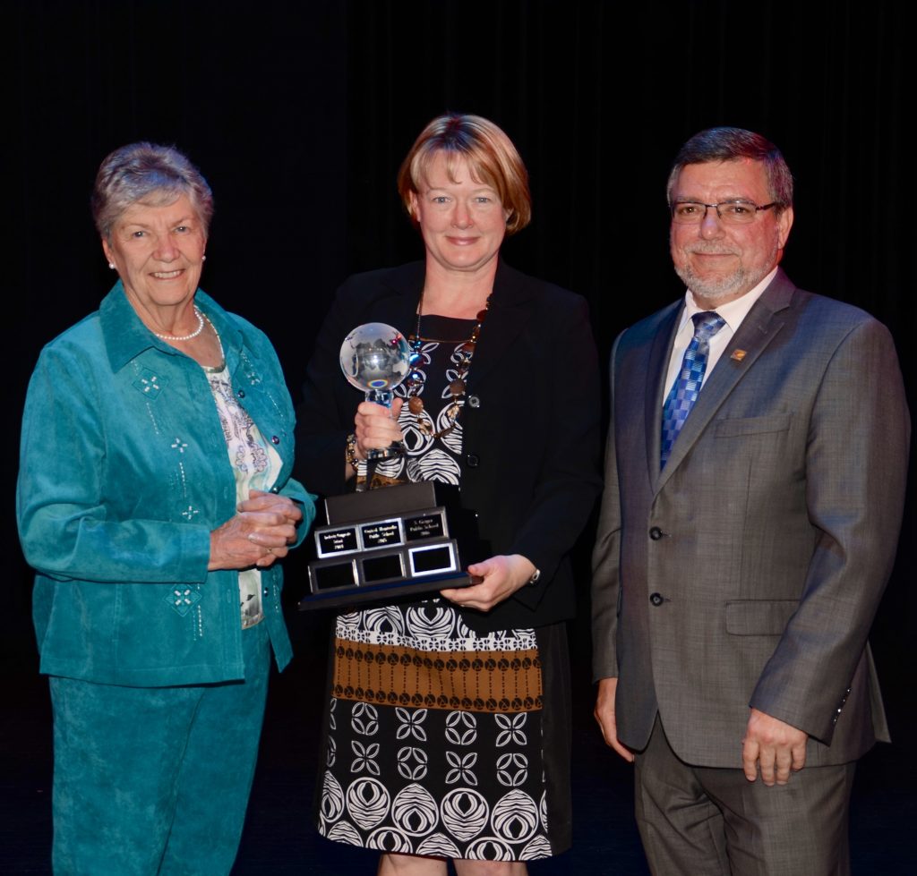 A staff member accepting an award