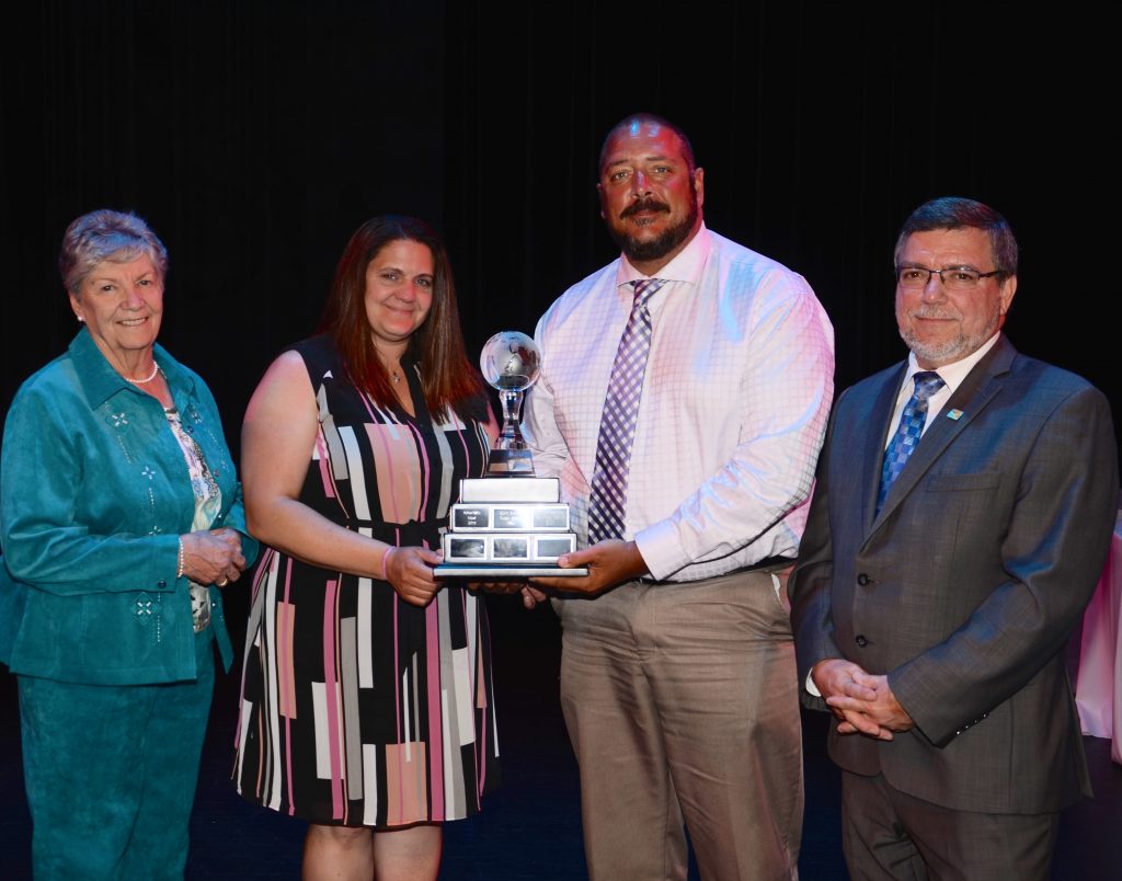 A staff member accepting an award