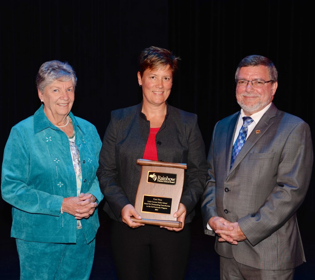 A staff member accepting an award