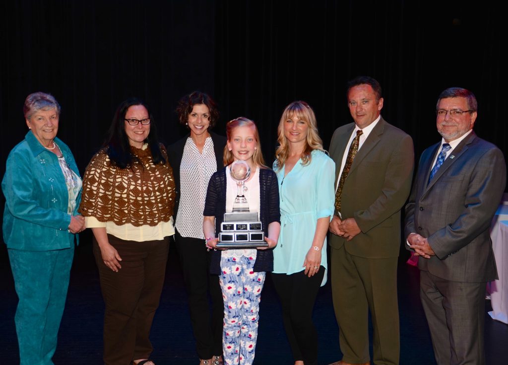 A staff member accepting an award