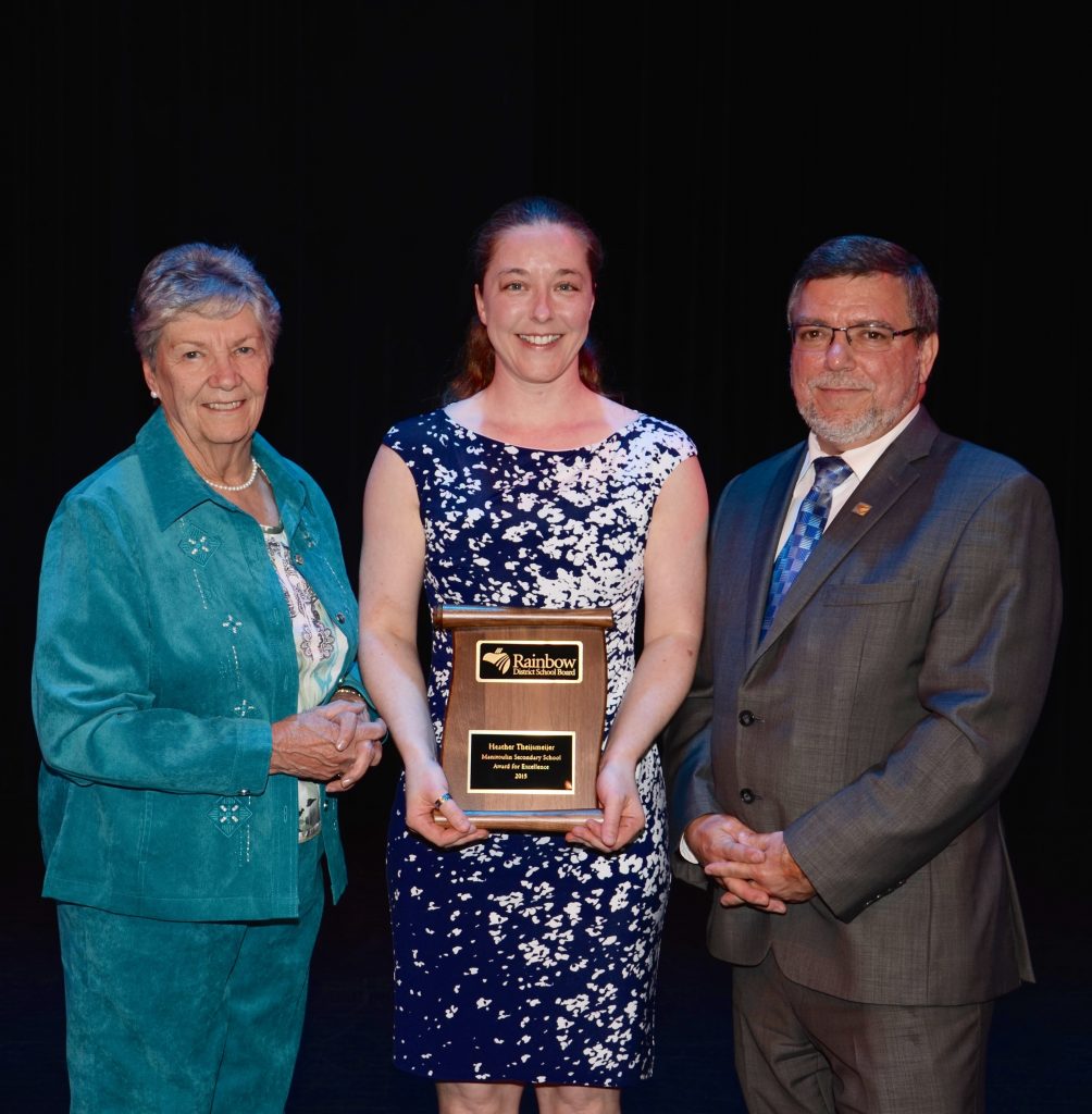 A staff member accepting an award