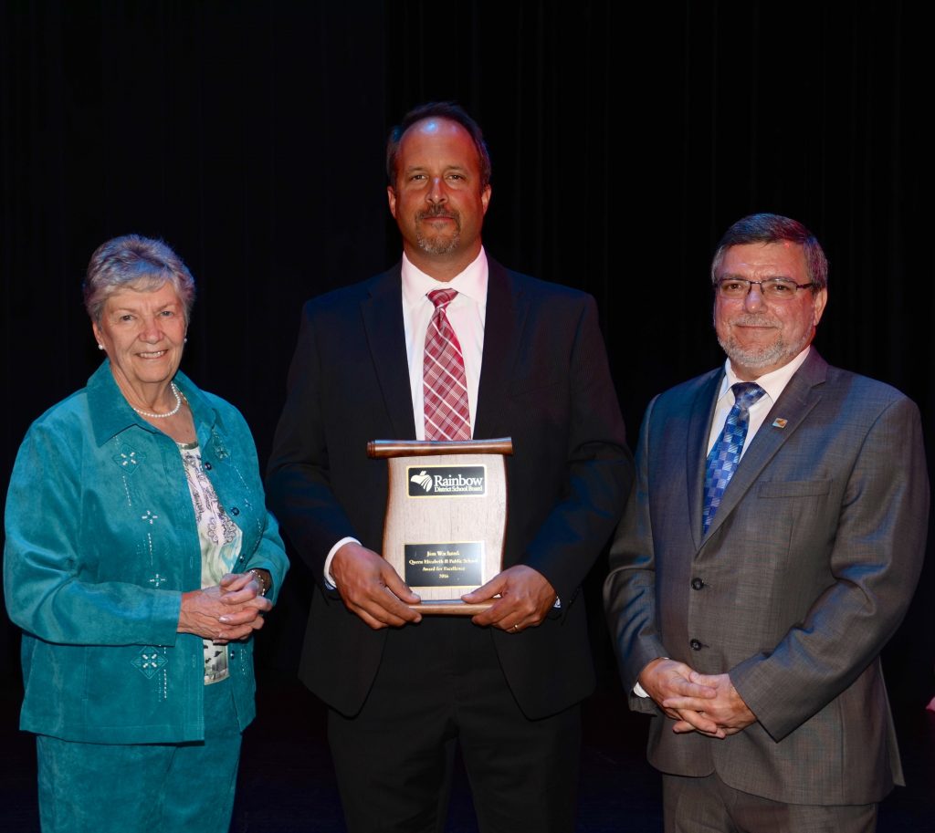 A staff member accepting an award