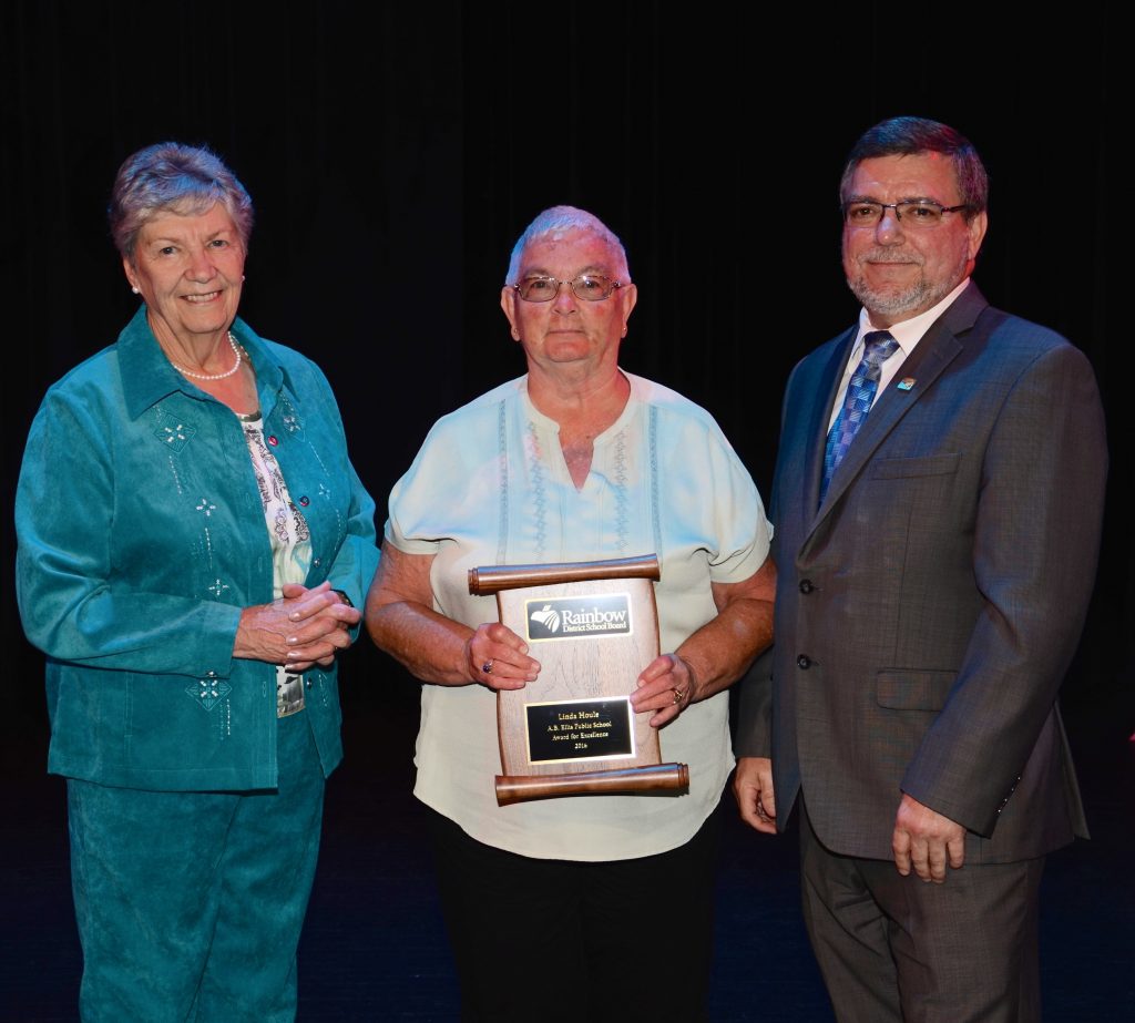 A staff member accepting an award