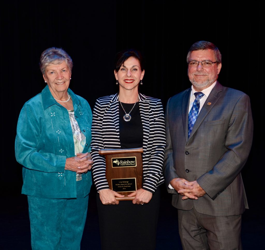 A staff member accepting an award