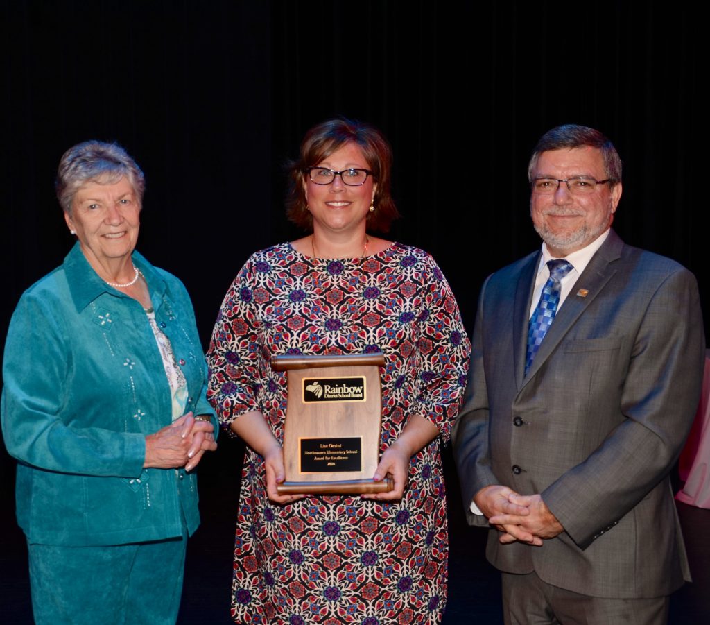 A staff member accepting an award