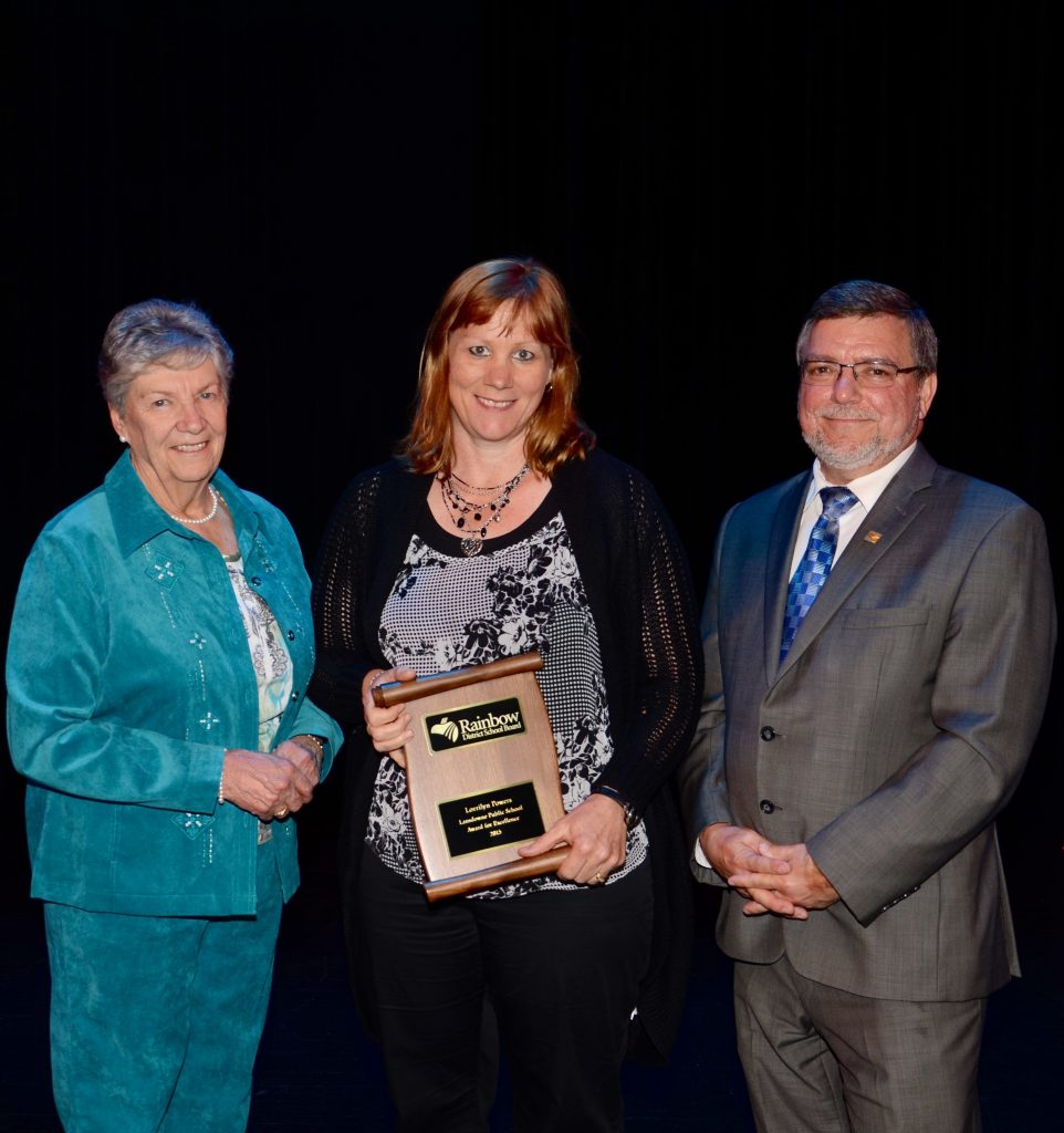 A staff member accepting an award