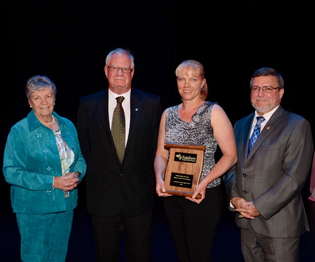 A staff member accepting an award