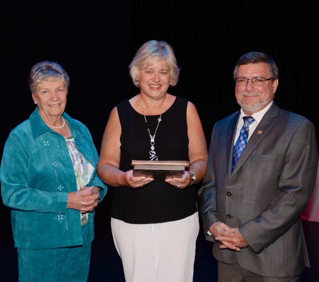 A staff member accepting an award