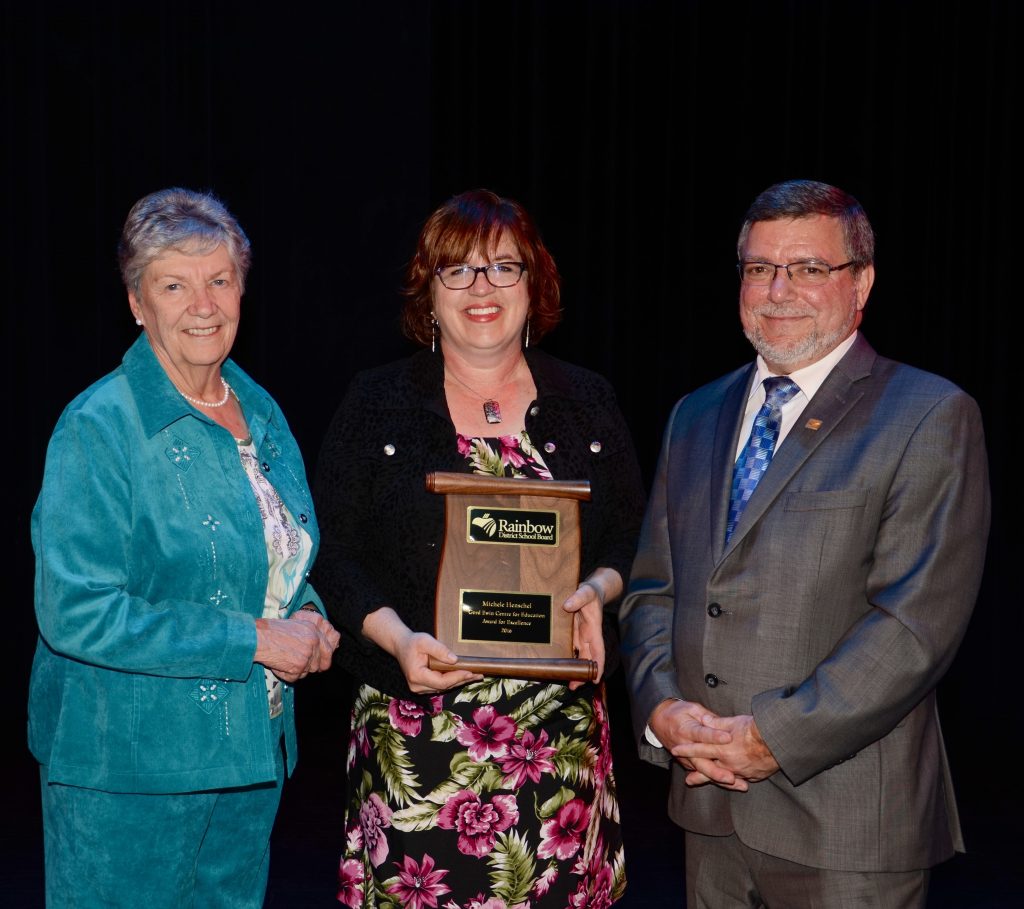 A staff member accepting an award