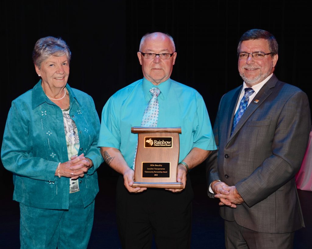 A staff member accepting an award