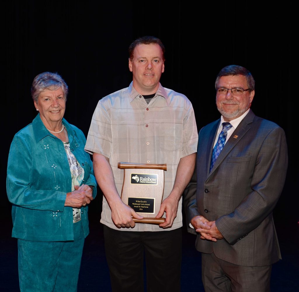 A staff member accepting an award