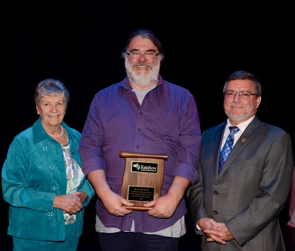 A staff member accepting an award