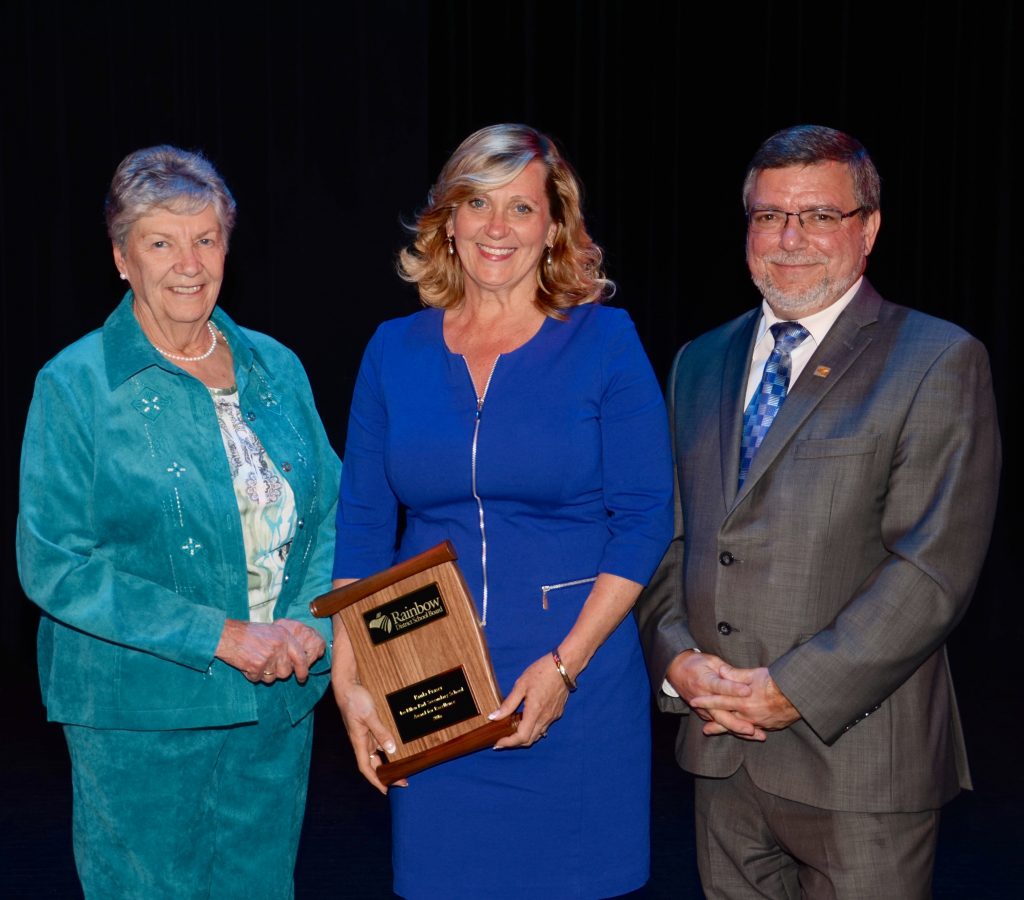 A staff member accepting an award