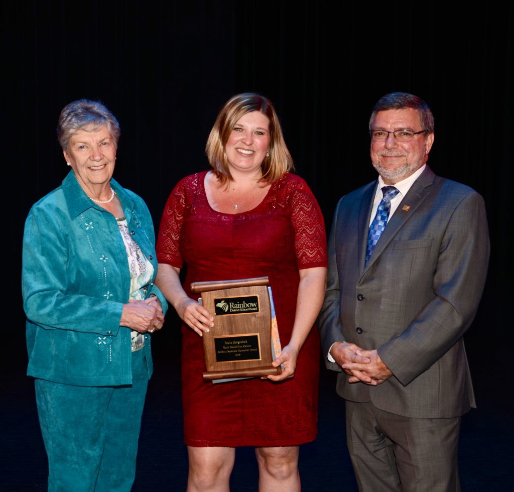 A staff member accepting an award