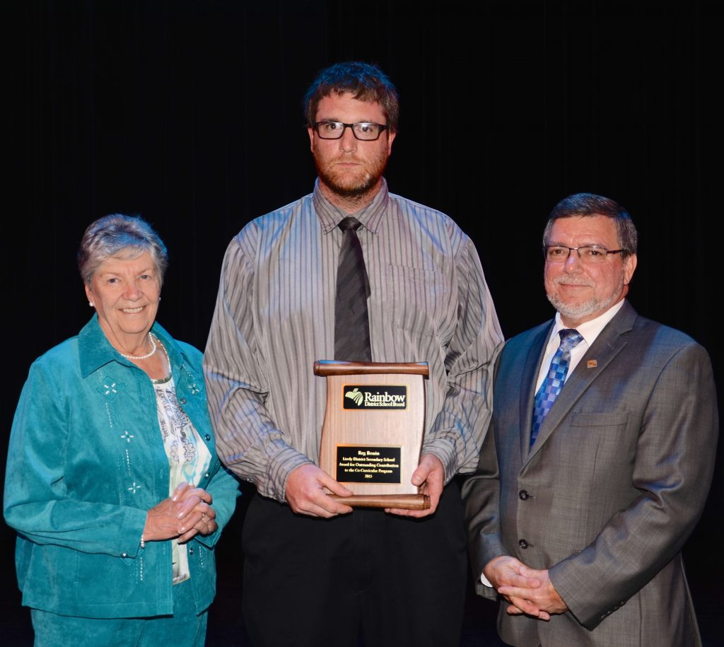 A staff member accepting an award