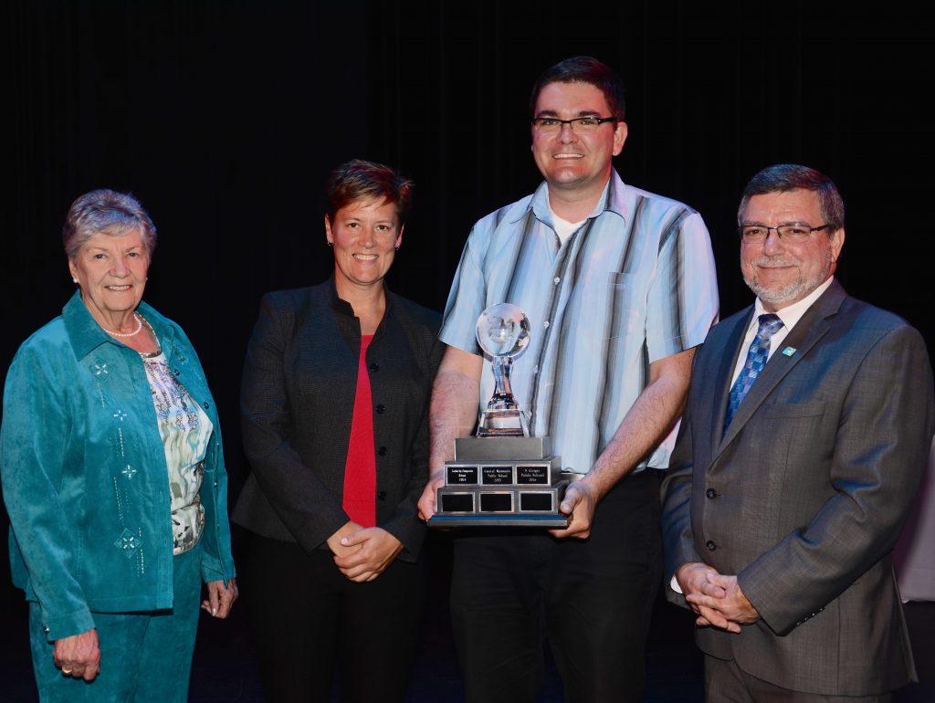 A staff member accepting an award