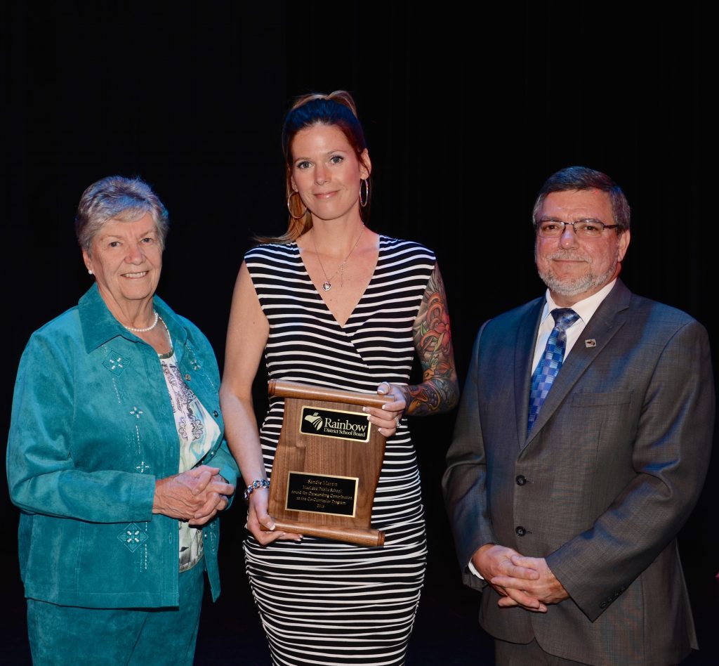 A staff member accepting an award