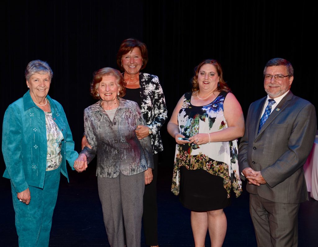 A staff member accepting an award