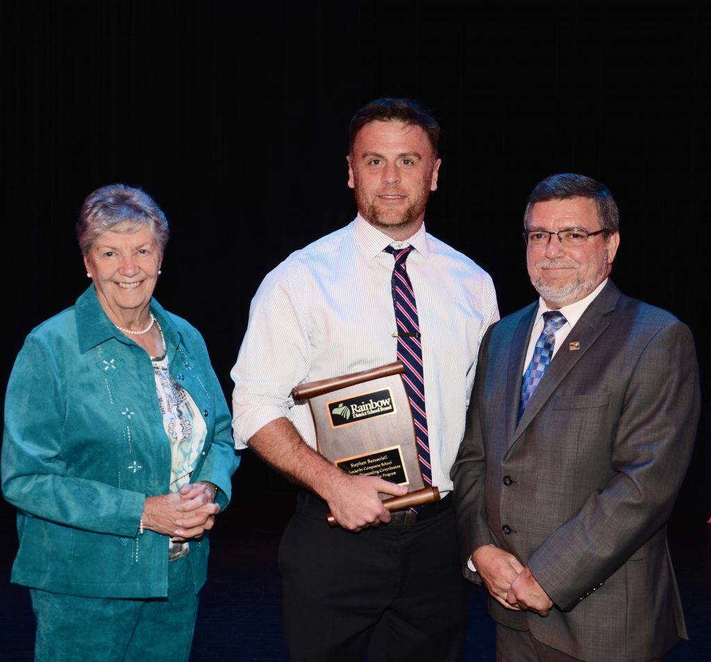 A staff member accepting an award