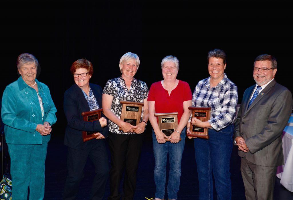 A staff member accepting an award