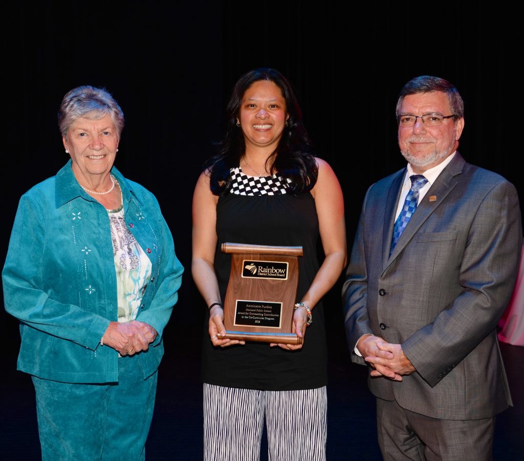 A staff member accepting an award