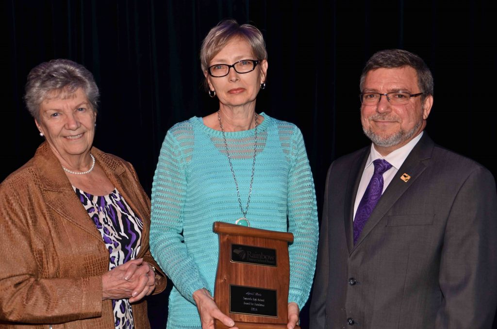 A staff member accepting an award