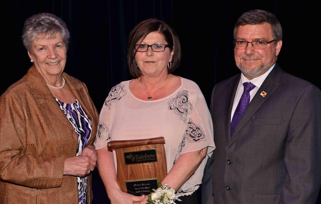 A staff member accepting an award