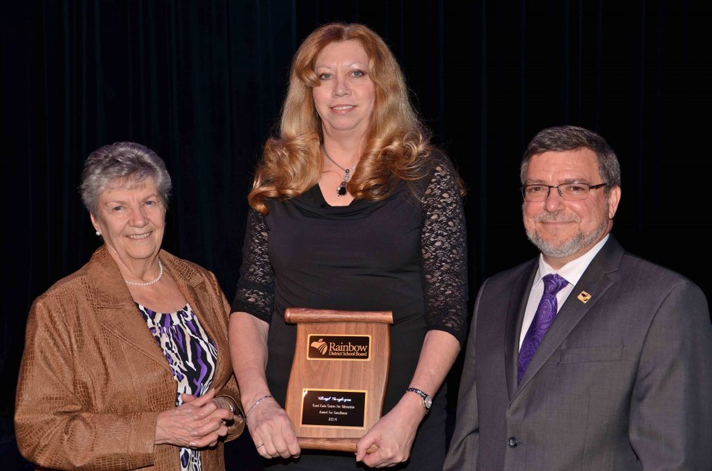 A staff member accepting an award