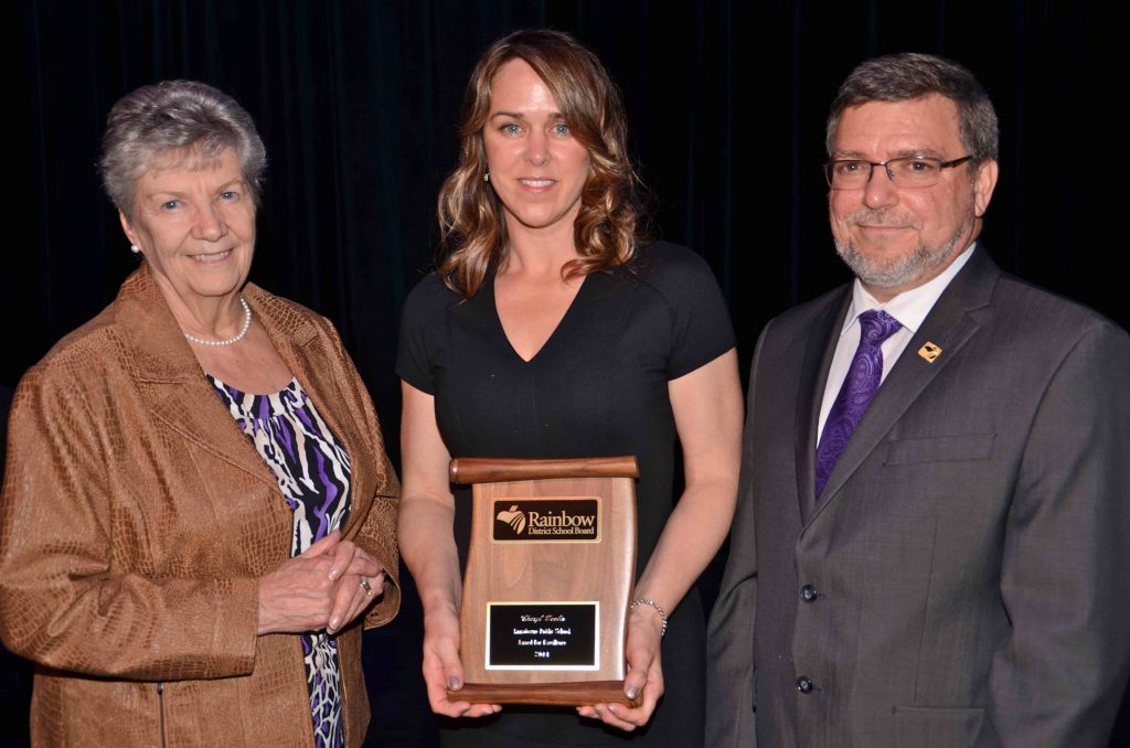 A staff member accepting an award