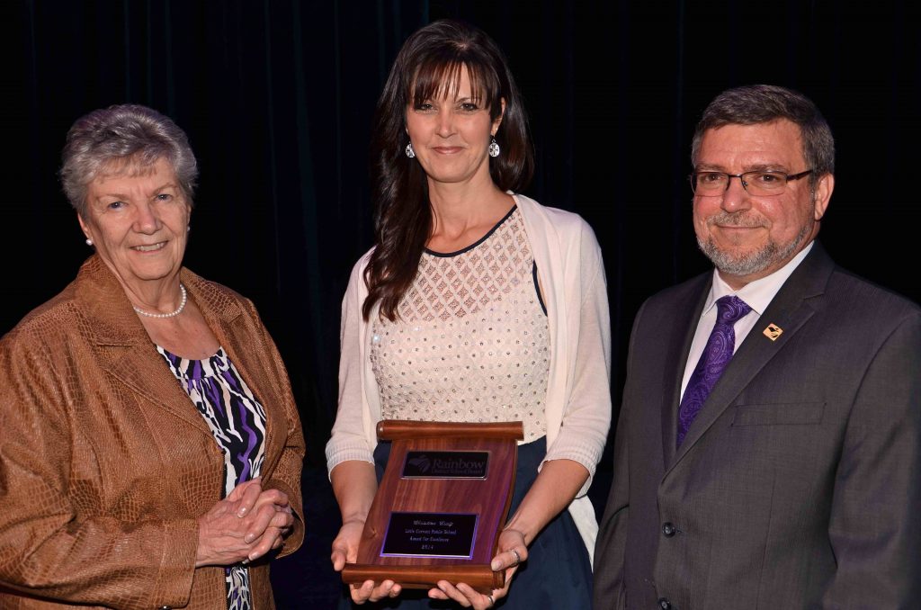 A staff member accepting an award