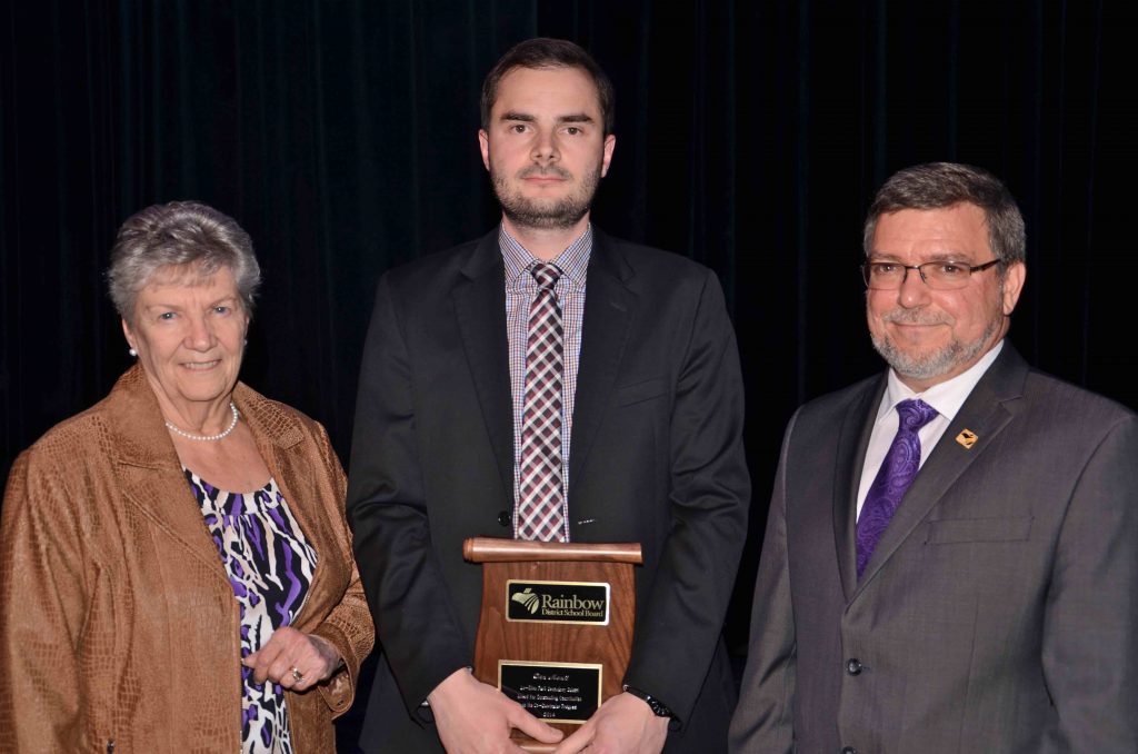 A staff member accepting an award