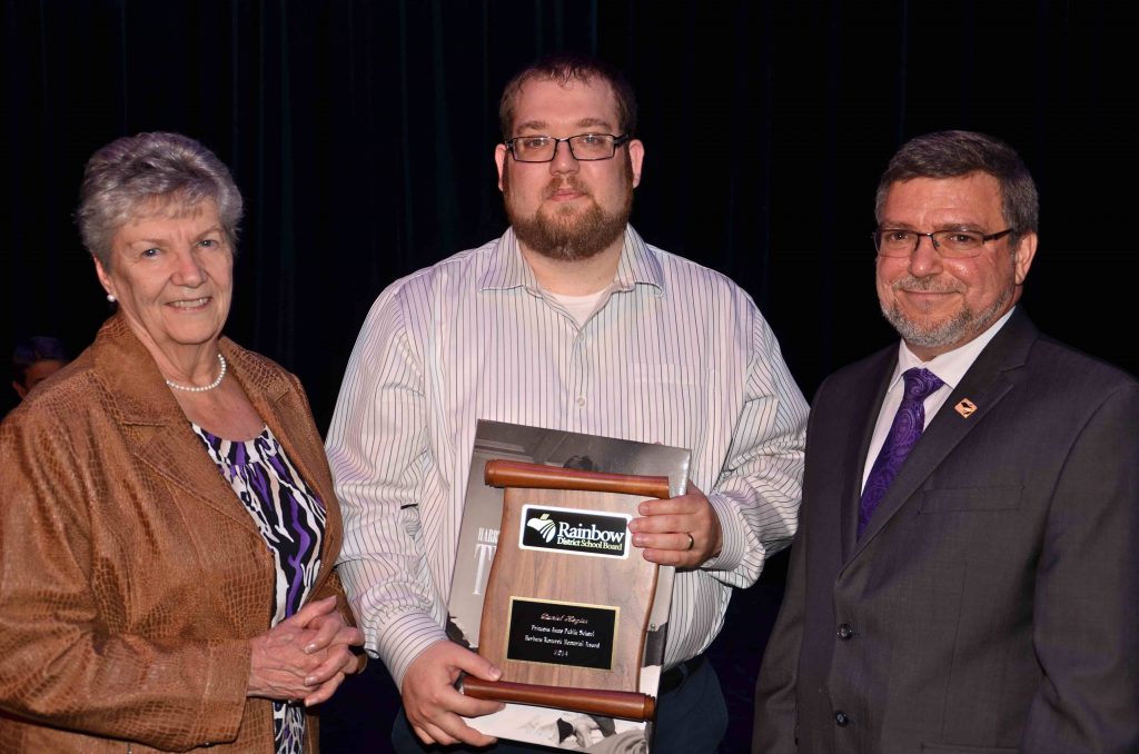 A staff member accepting an award