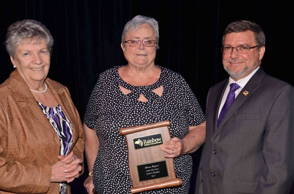 A staff member accepting an award