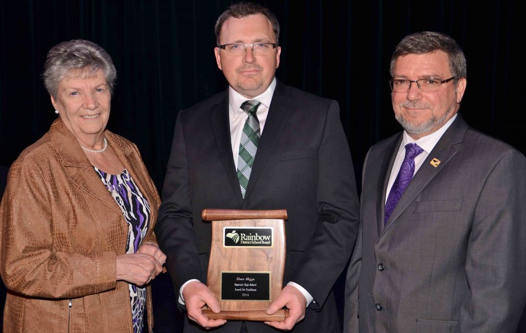 A staff member accepting an award