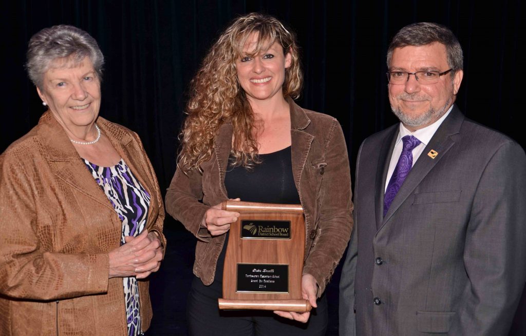 A staff member accepting an award