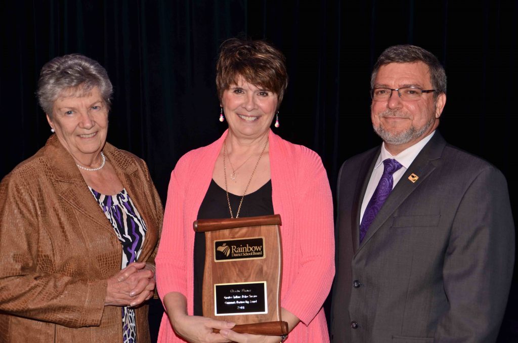 A staff member accepting an award