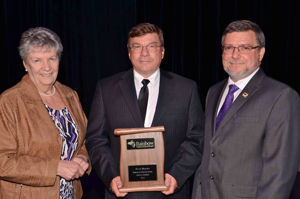 A staff member accepting an award