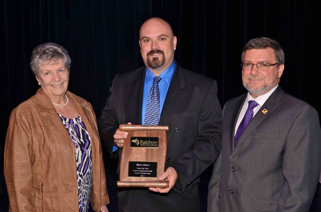 A staff member accepting an award