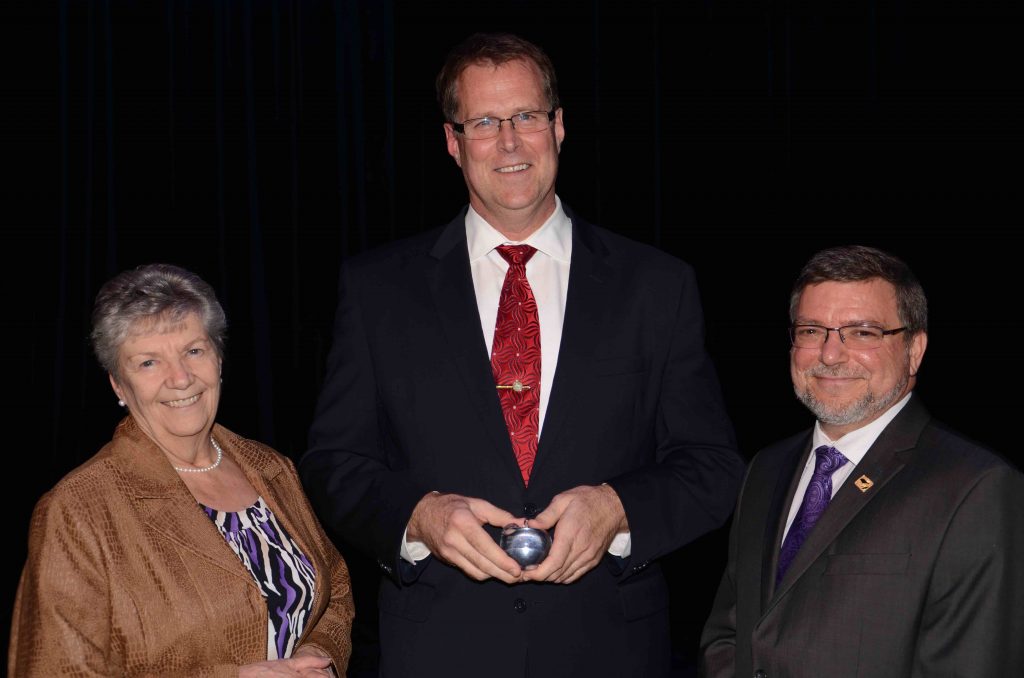 A staff member accepting an award