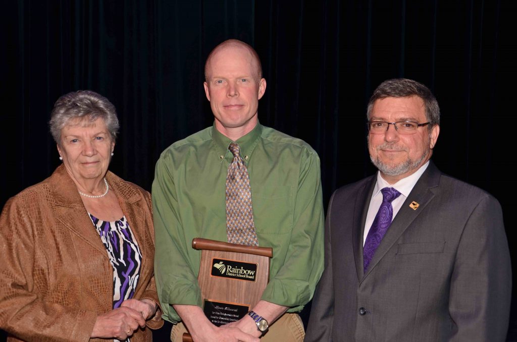 A staff member accepting an award