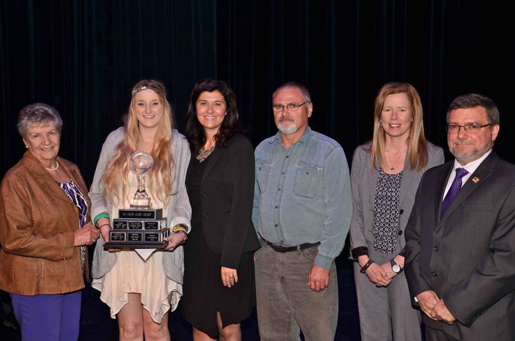 A staff member accepting an award