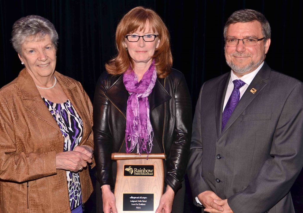 A staff member accepting an award