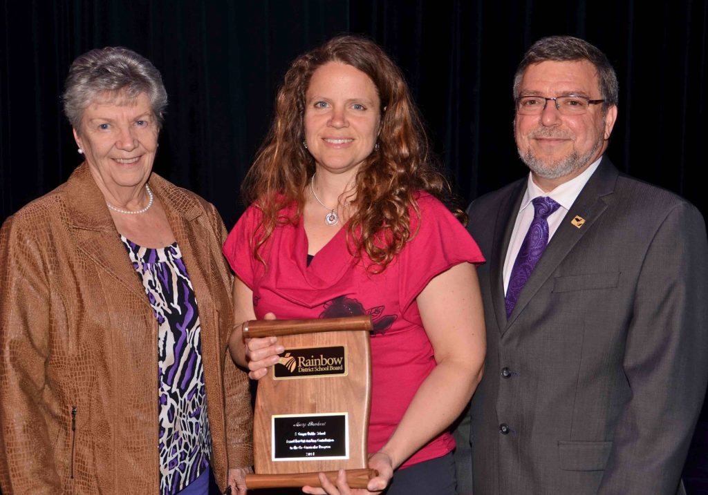 A staff member accepting an award