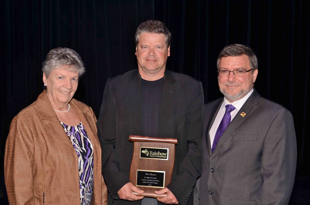 A staff member accepting an award