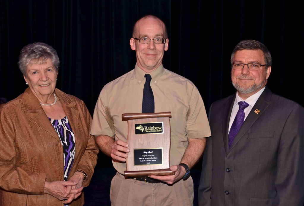 A staff member accepting an award