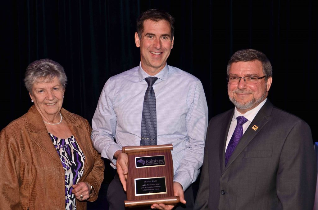 A staff member accepting an award