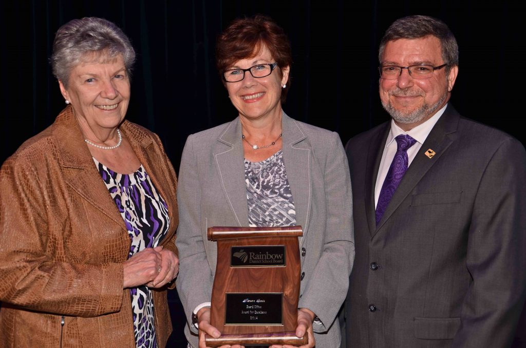 A staff member accepting an award