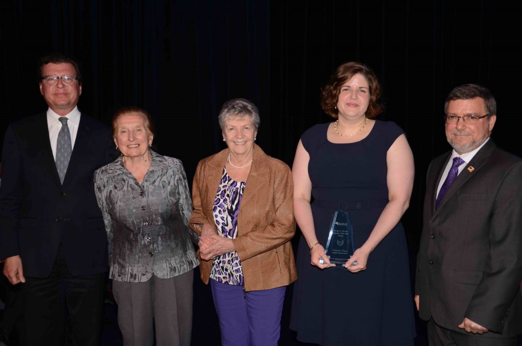 A staff member accepting an award