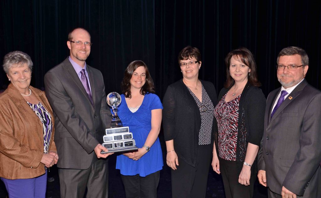 A staff member accepting an award